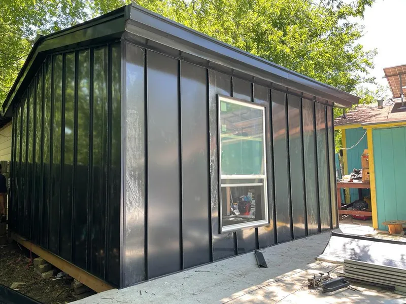 Black standing seam metal wall panels for Roof Inspection in Abbeville